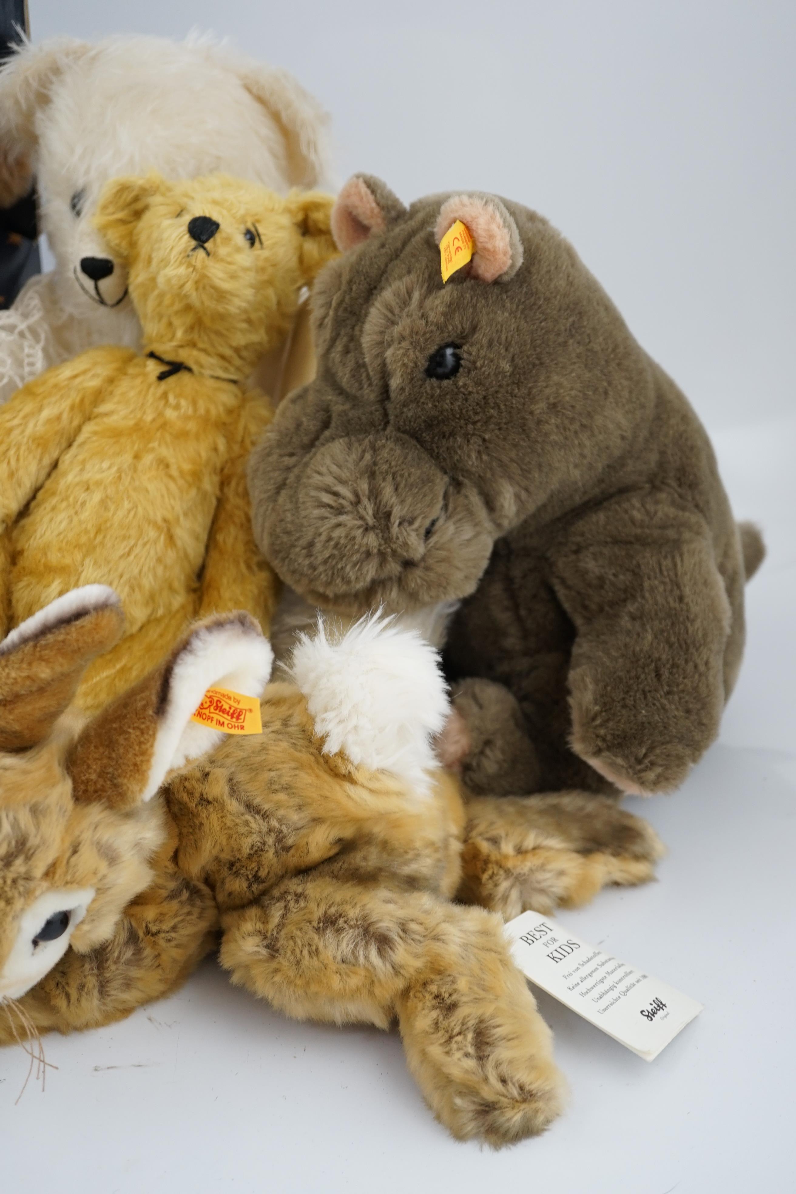Two Merrythought John Lewis bears, a Harrodd 2000 bear, a Steiff yellow tag rabbit, two Deans bears, a Steiff Cosy Hippo and a white artist bear (8)